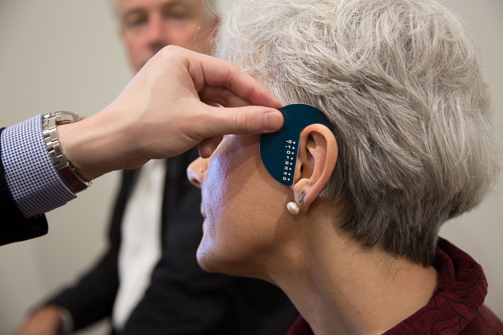 Woman getting fitted for hearing aid